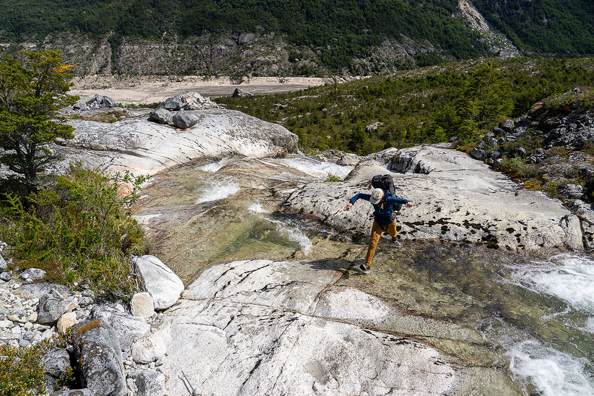 Waterproof hiking boots (wide shot crossing water)